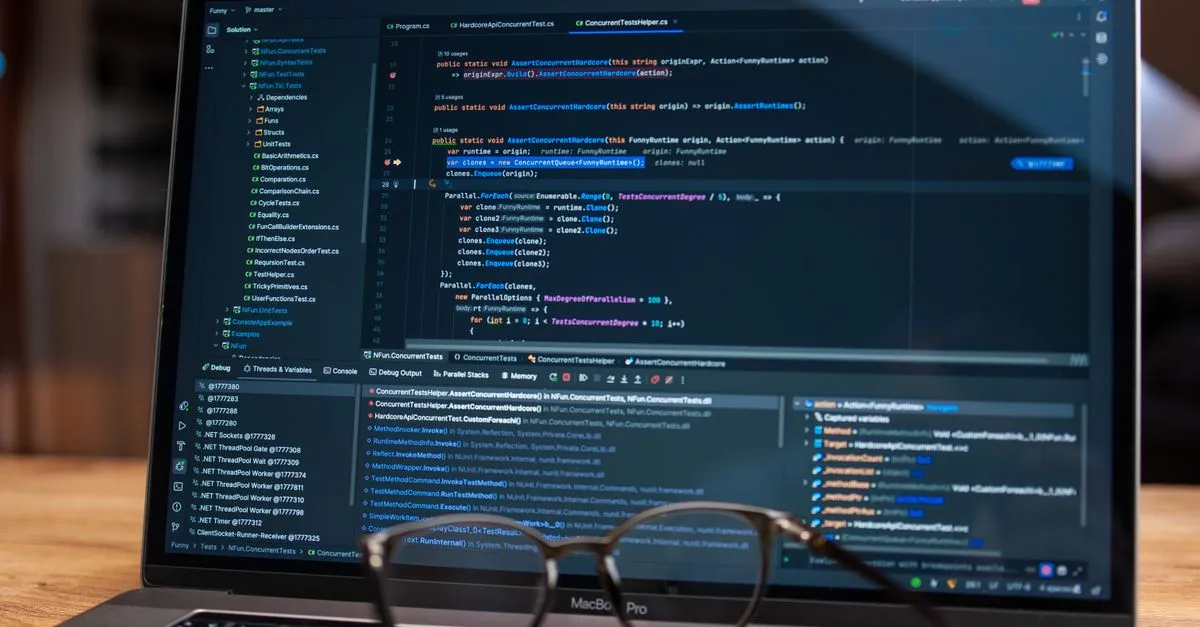 Web designer adjusting CSS box shadow styles on a laptop screen