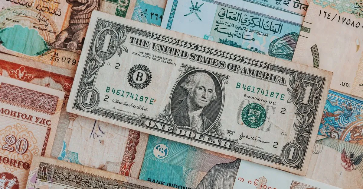 Currency exchange concept with US dollar and euro banknotes on a desk