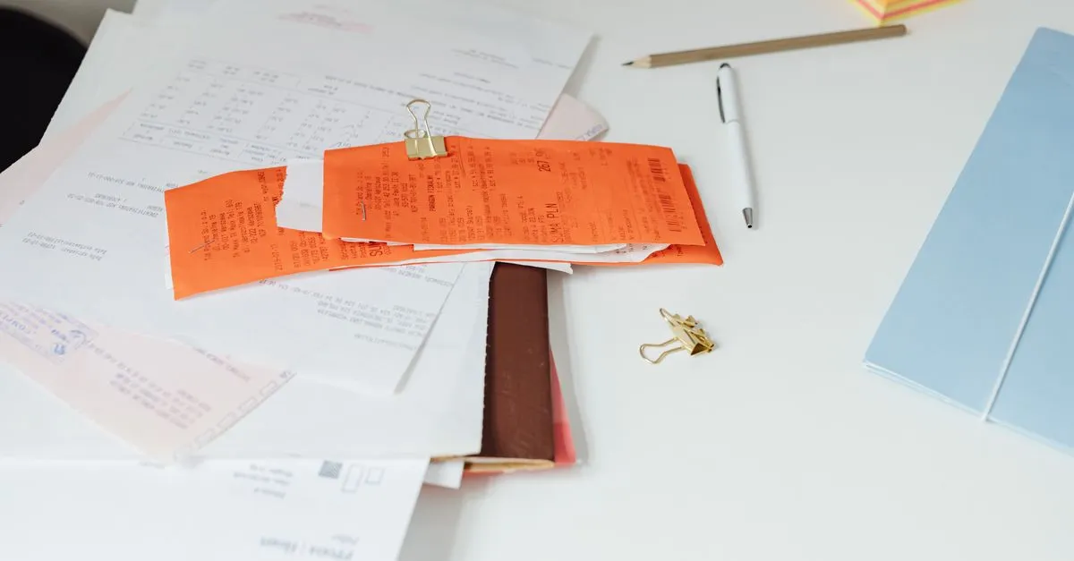 Shredded paper strips on a wooden desk, illustrating how to delete pages from a PDF