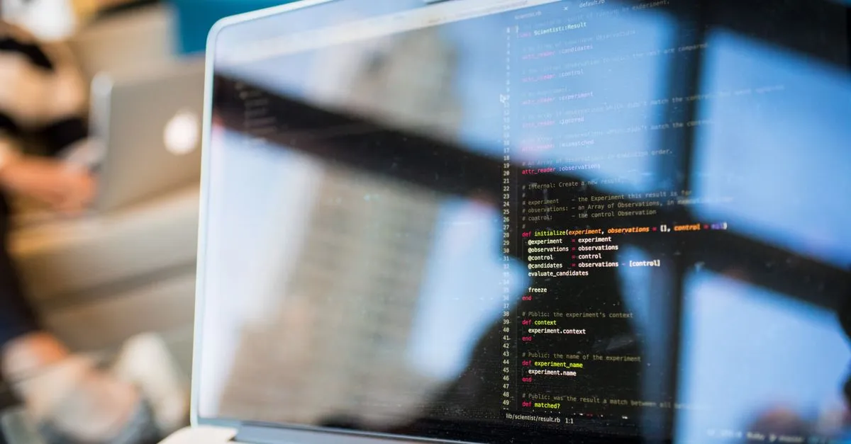 Developer inspecting a JSON Web Token on a laptop while debugging a login flow