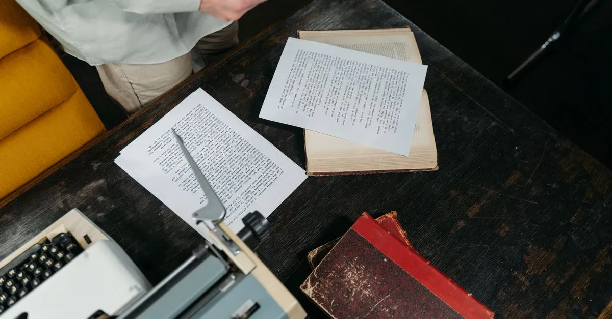 Printed document pages spread across a desk, ready to convert from PDF to JPG images