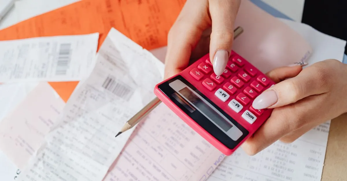 Receipt and calculator on a shop counter used to work out sales tax on a purchase