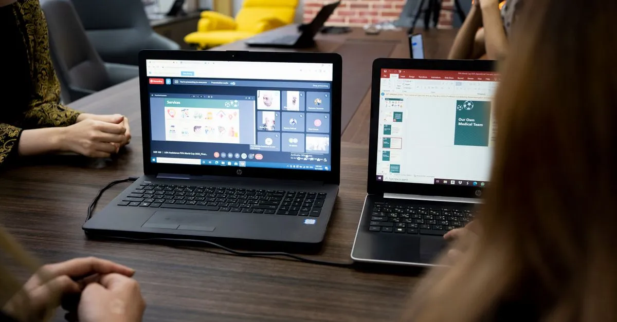 Laptop screen showing a grid of video thumbnails while downloading a YouTube thumbnail image
